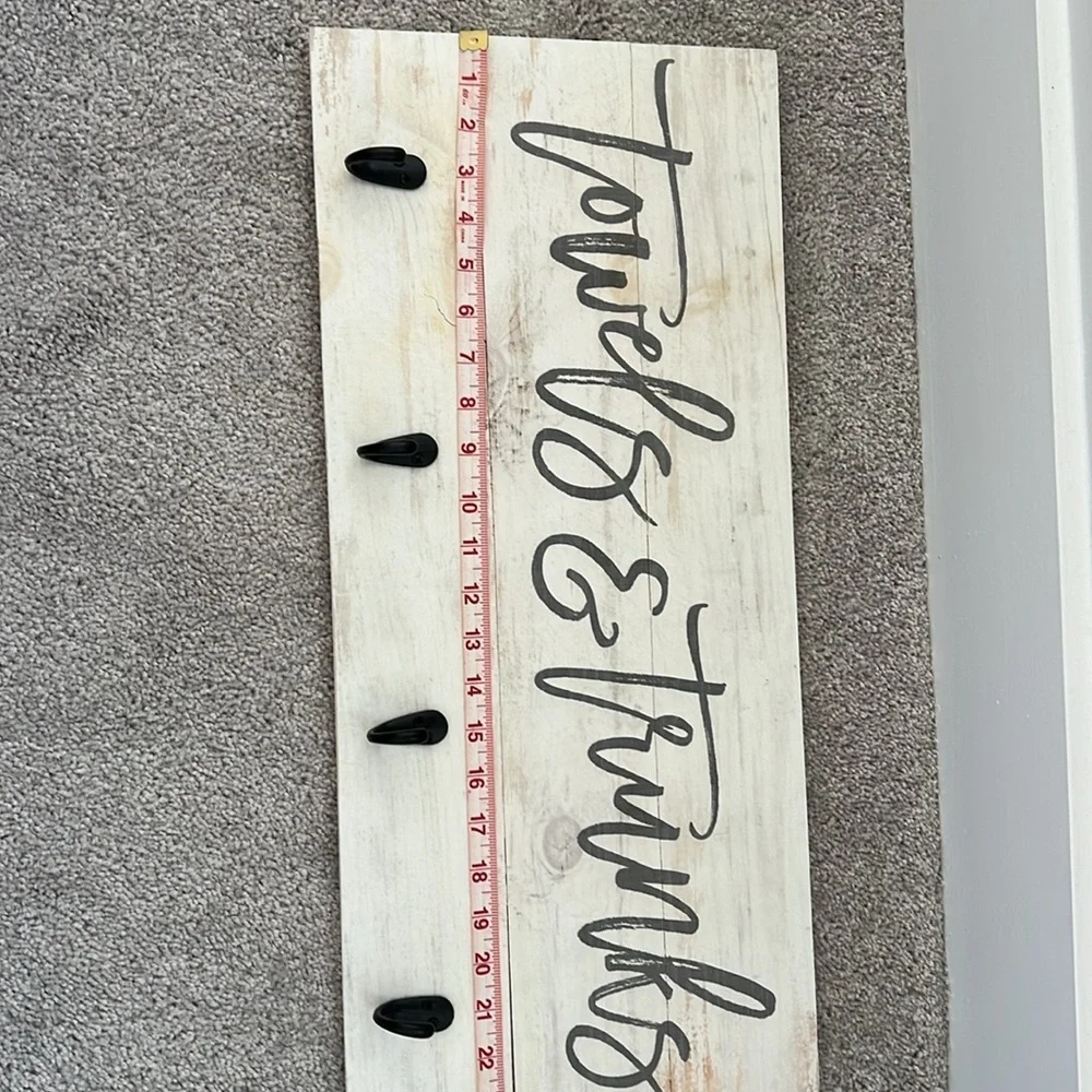 Wooden towels and trunks sign